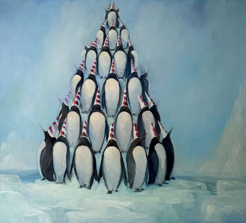 Group of penguins stacked in a pyramid on icy terrain.