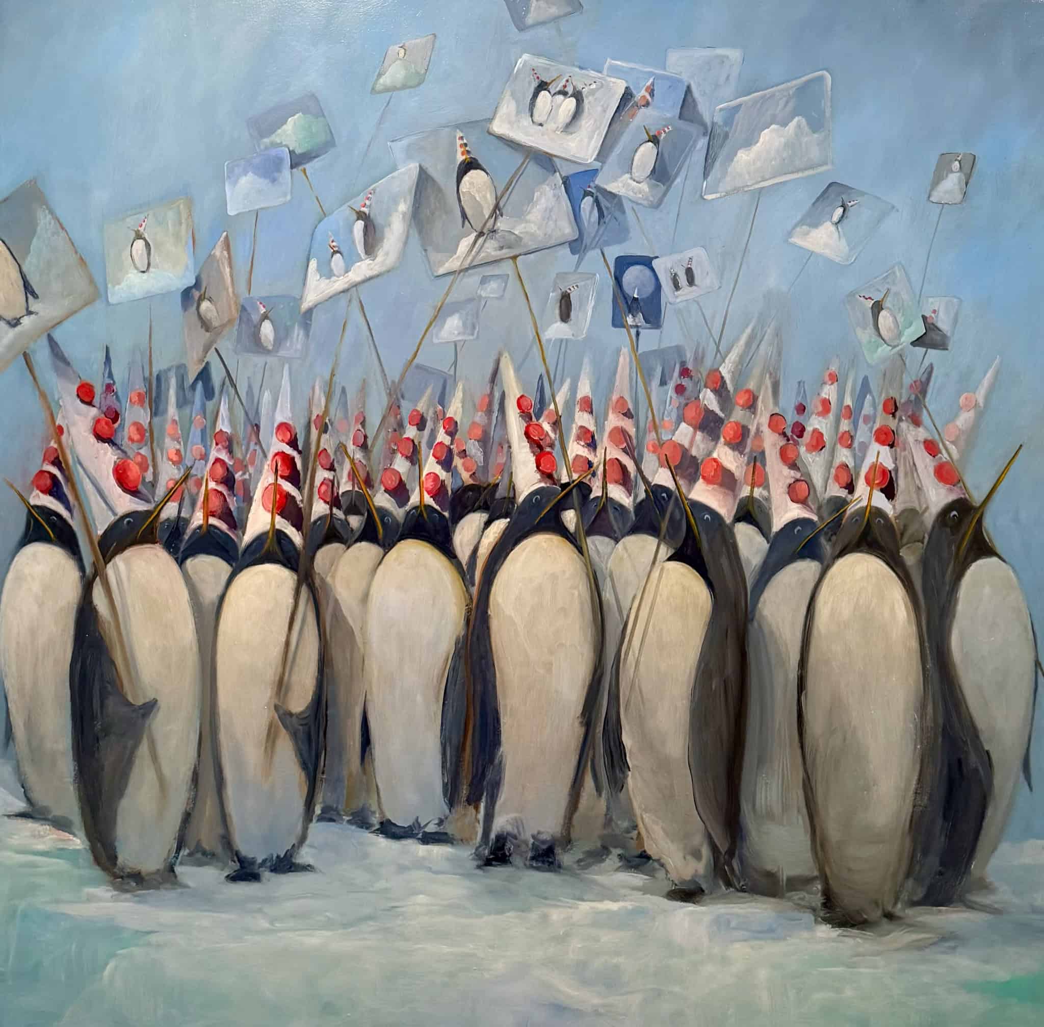 Group of penguins with signs in a protest scene.
