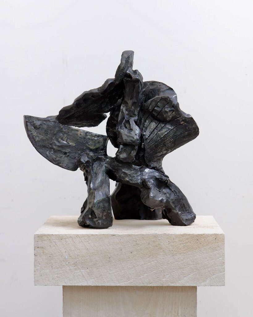 Moonlight Swim, black ceramic sculpture by Bruce Edelstein.